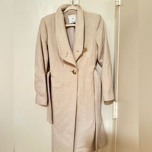 Beautiful white coat , below knee length